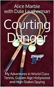 A tennis racket and gun are on the ground.